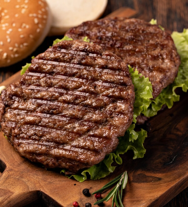 grilled vegetarian burgers on a bed of lettuce